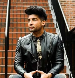 Luis Fornia seated on brick steps